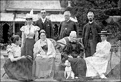 Reverend Newman (standing, third from left) pictured with his family in his later years.