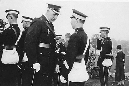 Sid Langley talking with the Commissioner during an inspection of Burton Latimer St John Ambulance Brigade, 1930s