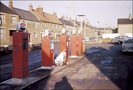 The pumps on the new forecourt.  the business was changing to one dealing with fuel and car sales