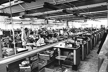 Photograph of operatives in the Closing Room stitching the uppers together