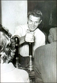 Photograph of Ron "Dot" Johnson, pulling pints at the Duke.