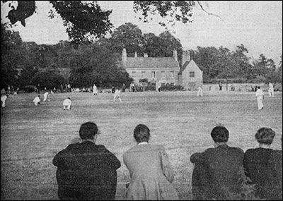 Photograph of Cricket Match with view of The Hall in the backgroundl 