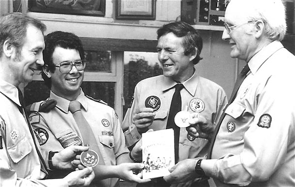 An exchange of badges during a visit by an American Scoout Leader 1980s.  L to R: Eddie Chennell, USA leader, John Northern and Ray Chester