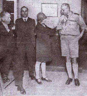 Photograph showing L to R: Mr H Chamberlain, Rev J Robins (pastor), Miss Eva Carvell, Scoutmaster H J Cook