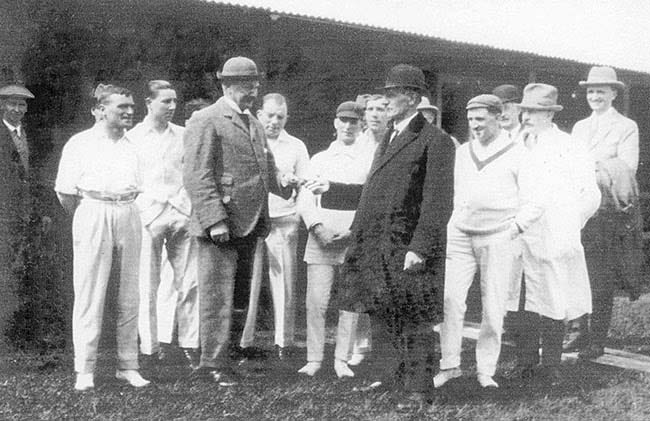 Photo of Burton Town Cricket Club 1930s President, Mr Wilfred T Harpur, handing over key to the club's new pavilion to Mr Bert Fox