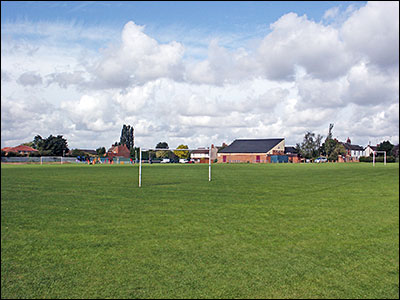 Photograph showing the Recreation Ground with the Community Centre in background