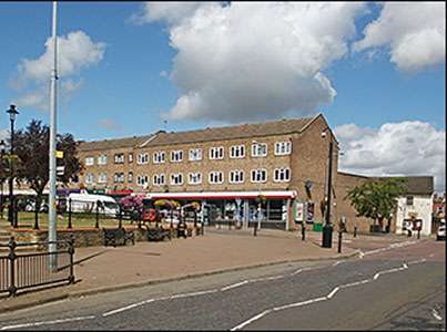 Photograph showing the Spar Shop and flats now located on the site of Denton's Farm