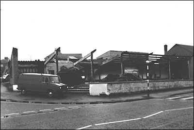 Photograph showing the showroom of Pole Position Cars (formerly Church Street Autos) after a disastrous fire in 1983