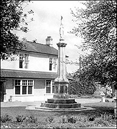 Photograph of the War memorial located in front of The Poplars