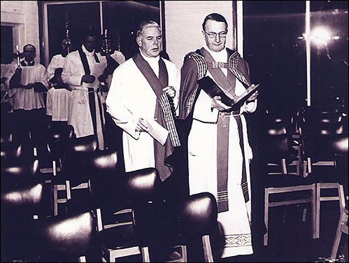 Photograph showing the Vicar General, Mgr Frank Diamond leading the procession at the opening of the church