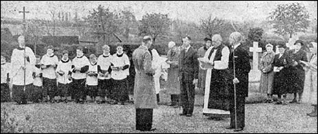 Further view of the consecration of burial ground in the new cemetery showing the church choir in the background