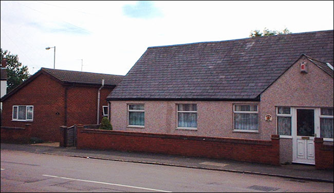 Photograph of Mission Room showing two dwellings