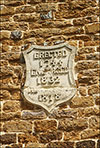 Photograph of plaque on front wall of chapel