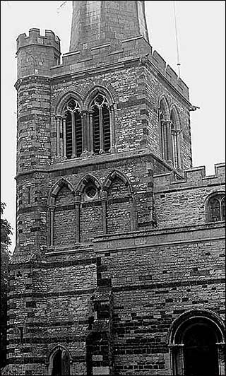 Photograph showing the south side of the tower with the belfry door and south door