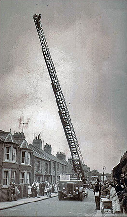 Gerald Baish on a turntable ladder in Alexandra Street
