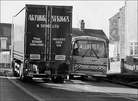 Photograph showing difficulty for vehicles negotiating narrow bend at Finedon Road/Higham Road/High Street junction.