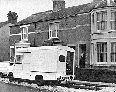 Photograph of Police officers at the home of Winnie Love at Station Road