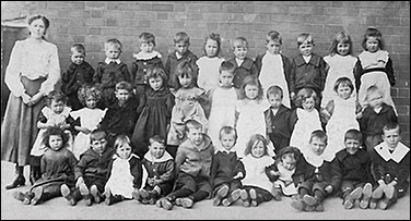 Photograph of Council School teacher with young pupils, early 1900
