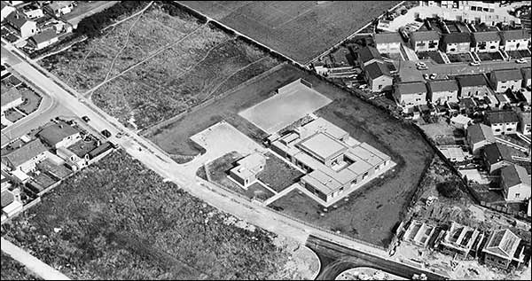 Meadowside School and Park Road under construction, showing some of the new houses recently built on allotment sites.  Two areas of rough ground can be seen where the allotments were previously used with some of the plot outlines still just visible.