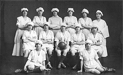 Photograph of Coles Boot Ladies Football Team 1920s.  Left to Right Back Row: Mrs G Williams, A Moisey, E Perkins, E Troop, I Rixon, D Dickman  Centre Row: E Larratt, L Clark, M Underwood, I Allen and L Larratt  Front Row: J Hume and E Austin