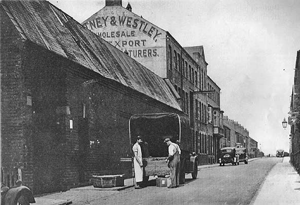 Photograph showing new factory extension with supply lorry