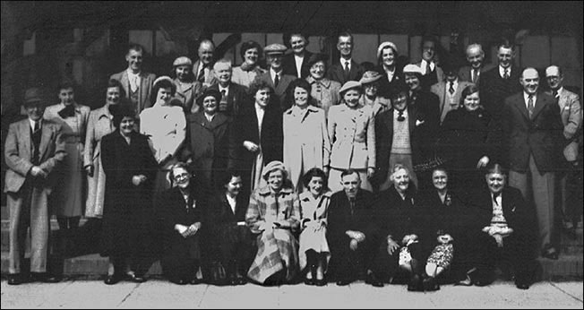 Photograph of a group of workers preparing for a factory outing c1950