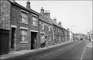 The High Causeway in 1969.  The demolitions have started at the far end.