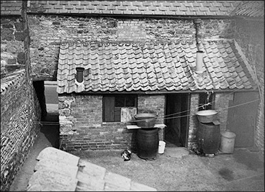 The entrance to Maycock's Yard from the High Street