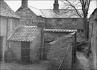 The rear of Maycock's Yard, looking west.