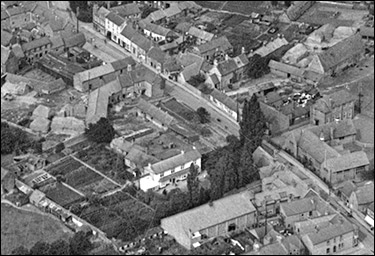 Aerila view of the central area of the High Street, taken in 1923.  The sachool, the cinema, The Poplars, and Denton's Farm are all clearly distinguishable