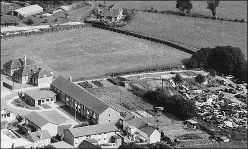 Now a scrapyard, with Latimer Close, Burton House and the school playing field.