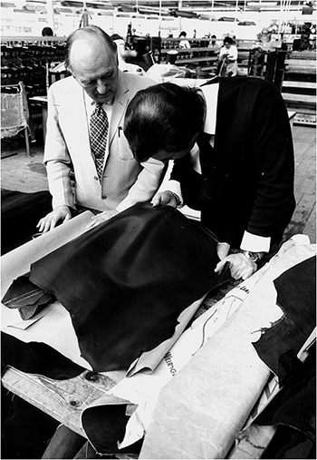 Photograph of Mr Angus Westley, Managing Director, selecting leather in preparation for Clicking process