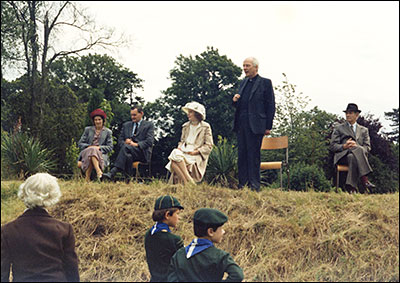 Photograph of Canon Pitt (Rector)  speakiing at a Church Garden Fete held at The Hall 8 July 1980.  L to R: Mrs Janet Harpur, Mr Richard Harpur, Lady George Scott, Rev Canon W E Pitt, Lord George Scott