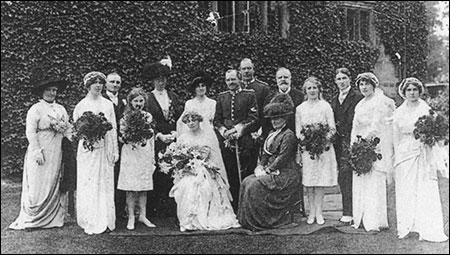 The de Crespigny wedding group showing Col de Crespigny standing behind the bridegroom and Mrs de Crespigny seated.  To the left of the bride is the younger daughter, Gwendoline, and third from the right is their only son, Arthur.