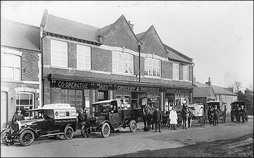 Co-op delivery vehicles in 1926. Wilf Ambler in the white overall.