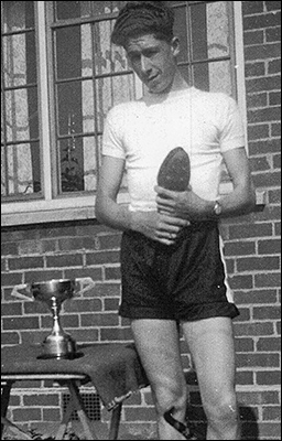 Malcom Craddock with the Arthur Nicholson Trophy. He broke the record for the 100 yards event at the 1949 Kettering & District Schools Sports day.