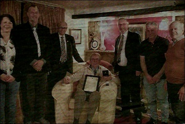 Bo Patrick pictured receiving his 50-year service award from the Football Association in 2017