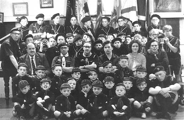 Scout Group Silver Jubilee.  The adults in the centre are Dennis B White (Parents' Committee Chairman), George Ramsbottom, Jack Addis, Barry Waite, Grace Wagstaff, ? Edmunds