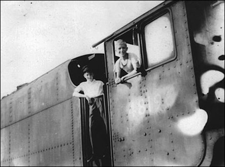 Photograph showing Michael Mutlow (right) with his friend Tony Granger on the engine near Burton Station