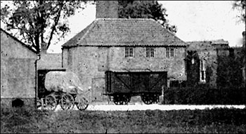 Photograph showing road and rail transport side by side at Wallis's Mill - now Weetabix.  