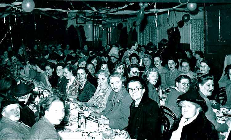 Lady members dinner at the Band Cllub 1952.  Some names from the nearest table: Mrs Barclay, June Smith and Mrs Jack Smith.  Some with their backs to the camera on the next table are: 2nd Mrs Austin and three places along, Mrs Capps.  Facing the camera on that table are: Mrs Borman, Janet Craddock, Sheila Fennell and next but one, Maud Bunyan.