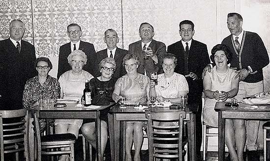 Social Event 1970s Standing L-R: Fred Wells, Dennis Crick, Tom Barber, ? Jack Craddock, ?,  Seated L-R: Gladys Wells, Josie Crick, Gwen Twelvetree, Evelyn Barber, Janet Craddock, ?.