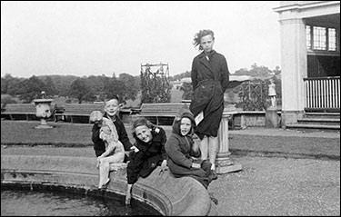Outing to Wicksteed Park. Seated are Neville, Angela and Pamela. Standing is Delia Wardle, a friend who lived next door to his aunty in Meeting Lane.